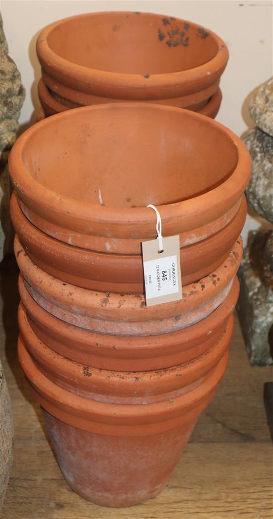 Twelve terracotta garden pots Diameter 24cm